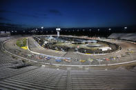 NASCAR Cup Series 63rd Annual Federated Auto Parts 400 at Richmond Raceway, Saturday 9/12/2020. Cars take the first turn amidst empty seats to begin a NASCAR Cup Series auto race Saturday, Sept. 12, 2020, in Richmond, Va. (James Wallace/Richmond Times-Dispatch via AP)