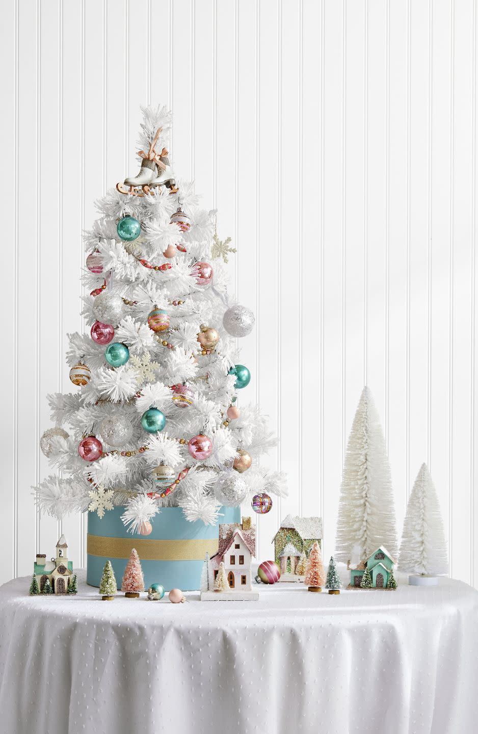 <p>Sure, the sparkling snowflakes, pastel baubles, and ice-skate topper on this tree are lovely. But we're most drawn to the DIY tree stand here: a simple hatbox. Talk about old-fashioned glamour!</p><p><a class="link " href="https://www.amazon.com/Darice-Paper-Mache-Craft-Boxes/dp/B001K7N1IA/ref=sr_1_41?tag=syn-yahoo-20&ascsubtag=%5Bartid%7C10050.g.28746492%5Bsrc%7Cyahoo-us" rel="nofollow noopener" target="_blank" data-ylk="slk:SHOP HATBOXES;elm:context_link;itc:0;sec:content-canvas">SHOP HATBOXES</a></p>