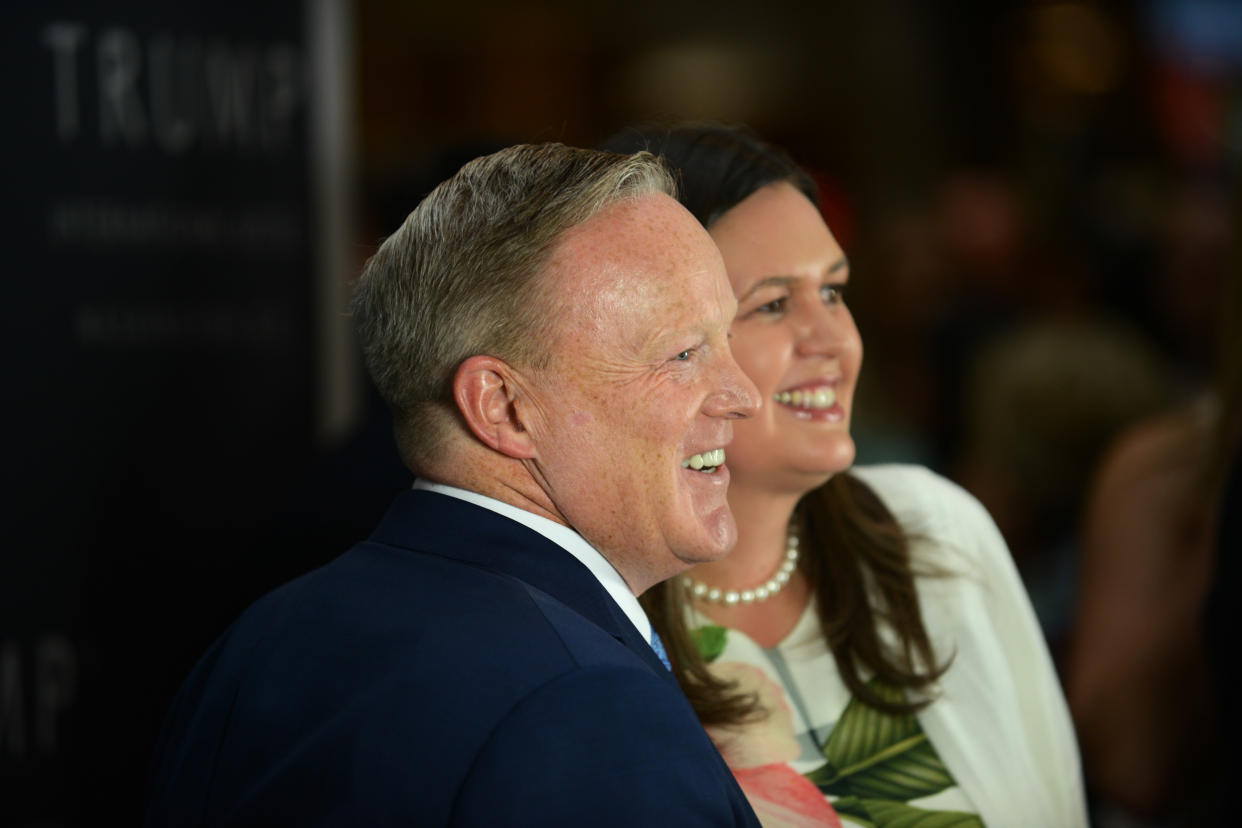 WASHINGTON, DC  - JULY 26: White House press secretary Sarah Elizabeth Huckabee Sanders, right, joins former White Press secretary Sean Spicer, left, inside the Trump International Hotel in Washington, D.C., July 26, 2018, for a book signing event for Spicer's book "The Briefing" of  (Astrid Riecken For The Washington Post via Getty Images)