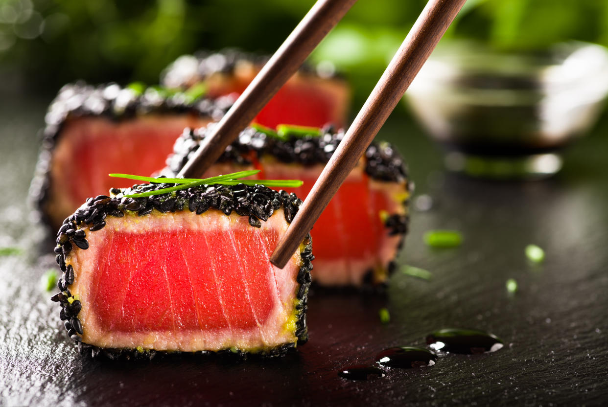 Fried tuna steak in black sesame with chopsticks