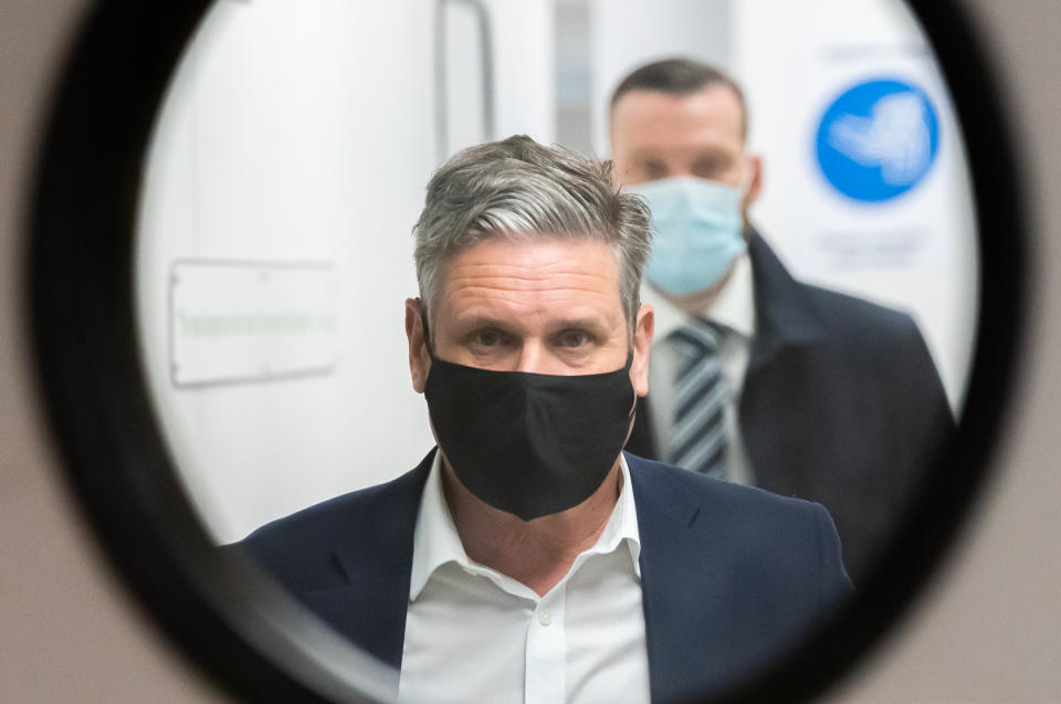 <p>Labour leader Sir Keir Starmer is shown a pair of night vision goggles while on a campaign visit to tech firm Qioptiq in St Asaph, North Wales. Picture date: Tuesday April 4, 2021.</p>
