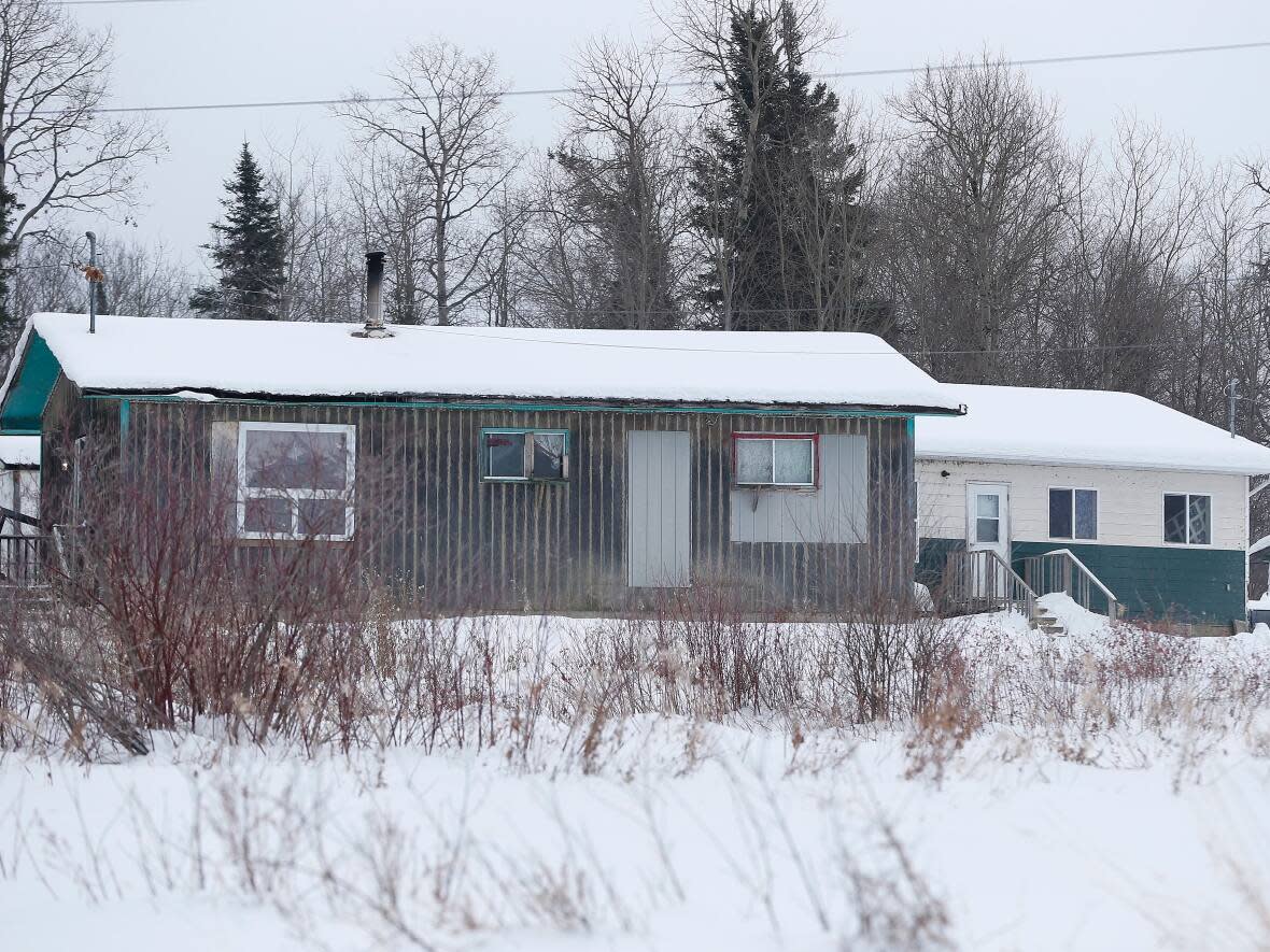 A house fire broke out in Pikangikum First Nation last week in northwestern Ontario, killing three people, including a child.  (John Woods/The Canadian Press - image credit)