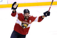 Florida Panthers defenseman Aaron Ekblad celebrates after Carter Verhaeghe scored during overtime of the team's NHL hockey game against the Pittsburgh Penguins, Thursday, Oct. 14, 2021, in Sunrise, Fla. The Panthers won 5-4. (AP Photo/Lynne Sladky)