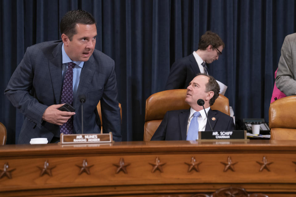 Rep. Devin Nunes, R-Calif, the ranking member on the House Intelligence Committee, left, takes his seat beside Chairman Adam Schiff, D-Calif., as they open a hearing on politically motivated fake videos and manipulated media, on Capitol Hill in Washington, Thursday, June 13, 2019.(AP Photo/J. Scott Applewhite)