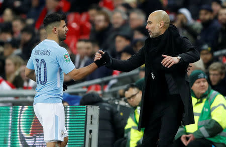 Soccer Football - Carabao Cup Final - Arsenal vs Manchester City - Wembley Stadium, London, Britain - February 25, 2018 Manchester City manager Pep Guardiola shakes hands with Sergio Aguero as he is substituted Action Images via Reuters/Carl Recine