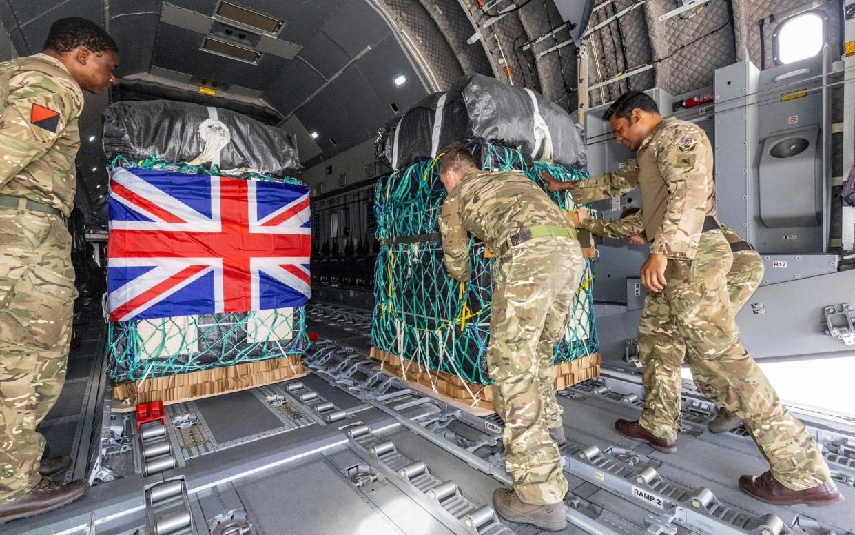 British Army personnel load humanitarian aid onto an A400M Atlas military plane as part of an action to address the plight of Palestinian people in Gaza, at an unspecified location in Jordan earlier this month