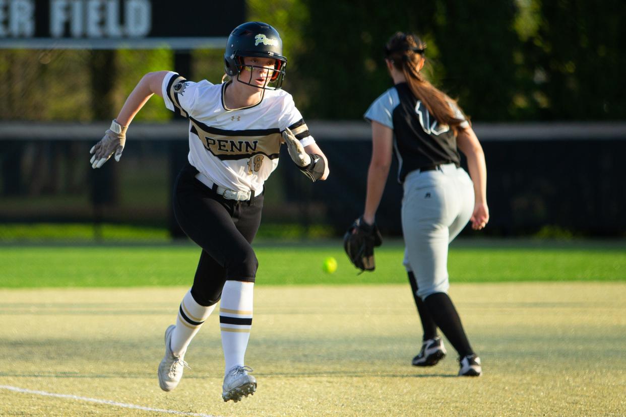 Penn junior Peyton Rudge (18) runs safely to home and scores during a high school softball game between Saint Joseph and Penn on Monday, May 6, 2024, at Penn High School in Mishawaka. Penn won 8-2.