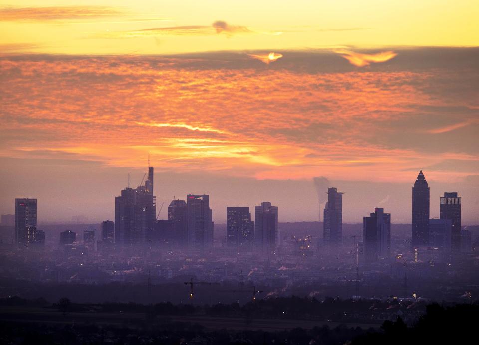 The sun is about to rise over the buildings