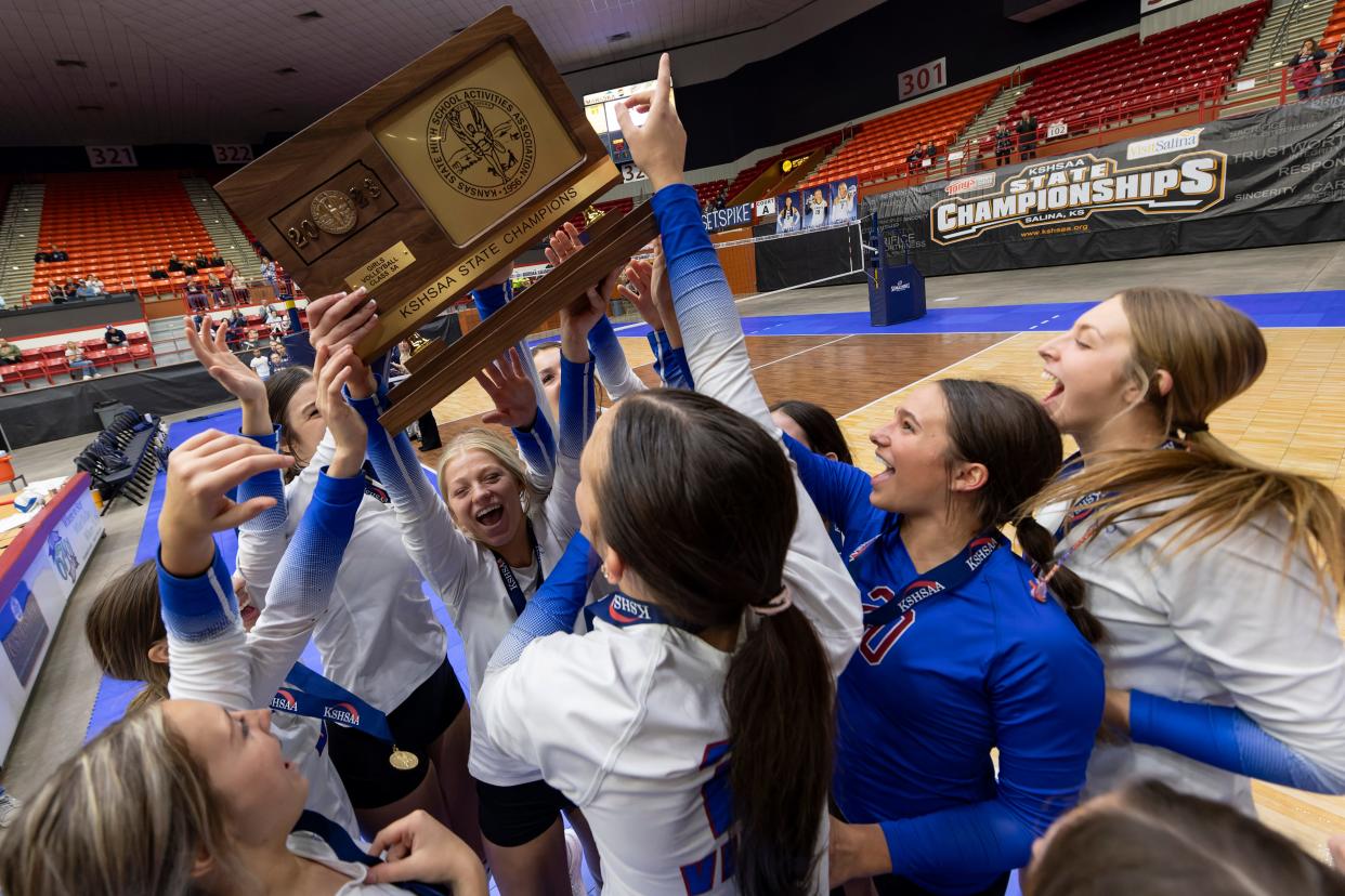 Seaman celebrates with the state title trophy Saturday, Oct. 28, 2023, at Tony’s Pizza Events Center in Salina, Kan.