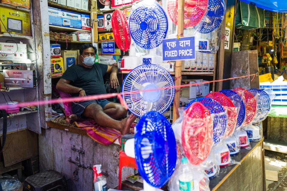 Fans can help, when people have electricity to run them. A man in India waits for customers on a day in 2020 when parts of the country expected to reach 122 degrees Fahrenheit. <a href="https://www.gettyimages.com/detail/news-photo/man-waits-for-customers-displaying-fans-at-his-store-amid-news-photo/1215441006" rel="nofollow noopener" target="_blank" data-ylk="slk:Jewel Samad/AFP via Getty Images;elm:context_link;itc:0;sec:content-canvas" class="link ">Jewel Samad/AFP via Getty Images</a>