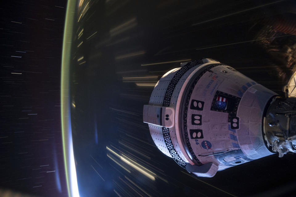 In this long-exposure photo provided by NASA, Boeing's Starliner spacecraft is docked to the Harmony module of the International Space Station on July 3, 2024. (NASA via AP)