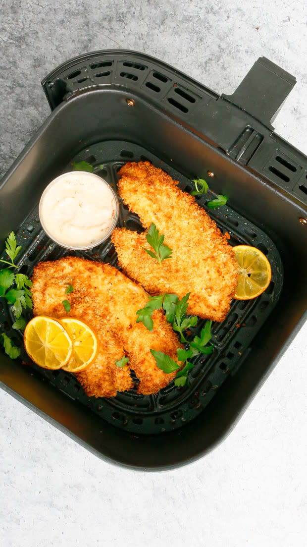 <p>Kitchen at Hoskins</p><p>This air fryer tilapia recipe has a crunchy crumb with perfectly cooked juicy fish! It is absolutely delicious with a quick homemade tartar sauce or made into easy fish tacos.</p><p><strong>Get the recipe: <a href="https://www.kitchenathoskins.com/2021/02/24/air-fryer-tilapia/" rel="nofollow noopener" target="_blank" data-ylk="slk:Air Fryer Tilapia;elm:context_link;itc:0;sec:content-canvas" class="link ">Air Fryer Tilapia</a></strong></p>