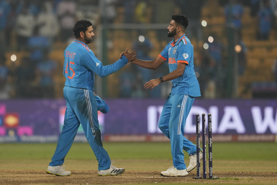 India's captain Rohit Sharma, right, and Mohammed Siraj congratulate each others after winning the ICC Men's Cricket World Cup match against Netherlands in Bengaluru, India, Sunday, Nov. 12, 2023. (AP Photo/Aijaz Rahi)