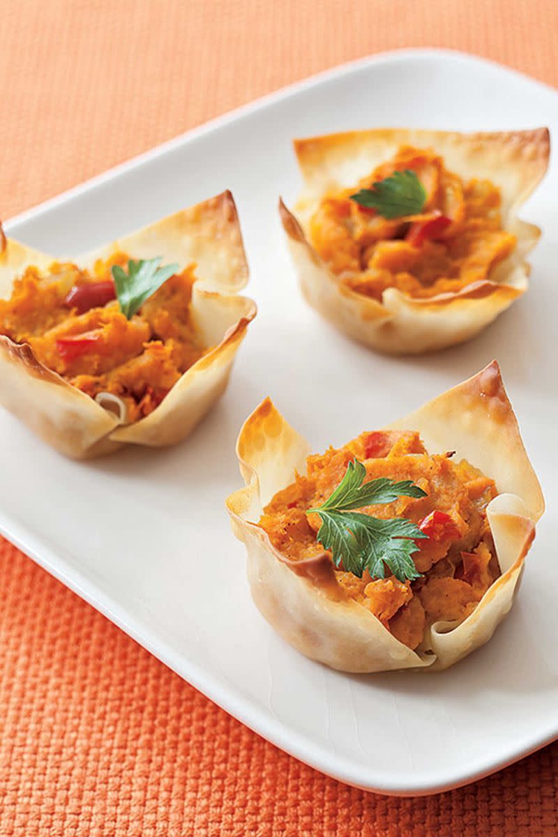 <p>Roast the sweet potatoes ahead of time and you'll get a headstart on this crowd-pleasing app. A muffin tin helps shape wonton wrappers into perfect bite-sized cups. </p><p><a href="https://www.womansday.com/food-recipes/food-drinks/a4585/leftovers-recipe-curry-sweet-potato-cups-102043/" rel="nofollow noopener" target="_blank" data-ylk="slk:Get the recipe for Curry Sweet Potato Cups.;elm:context_link;itc:0;sec:content-canvas" class="link "><em>Get the recipe for Curry Sweet Potato Cups.</em></a></p>