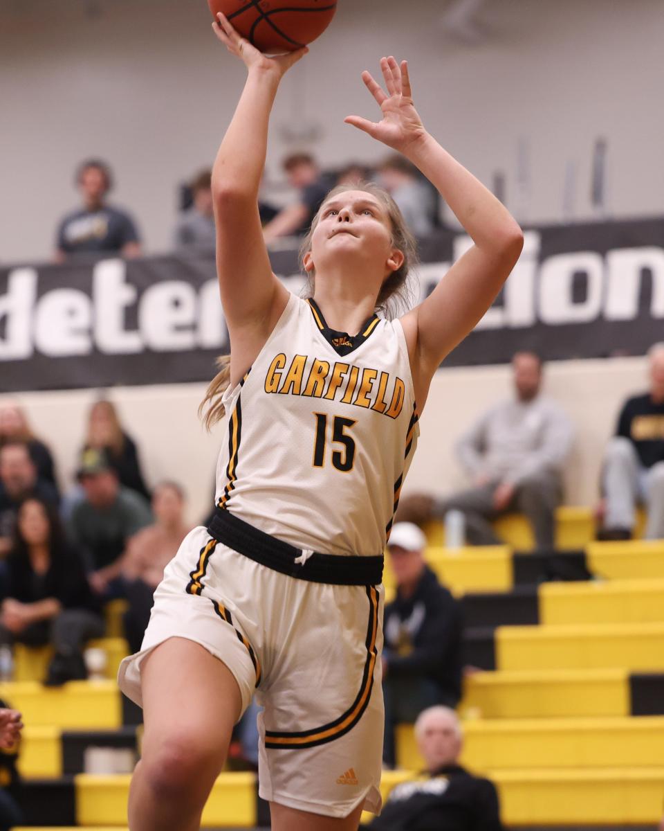 Garfield senior guard Nora Trent goes in for a lay-up during Thursday night's basketball game against the Liberty Leopards at James A. Garfield High School.