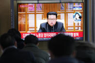 People watch a TV showing a file image of North Korean leader Kim Jong Un shown during a news program at the Seoul Railway Station in Seoul, South Korea, Thursday, Jan. 20, 2022. Accusing the United States of hostility and threats, North Korea on Thursday said it will consider restarting "all temporally-suspended activities" it had paused during its diplomacy with the Trump administration, in an apparent threat to resume testing of nuclear explosives and long-range missiles. (AP Photo/Ahn Young-joon)