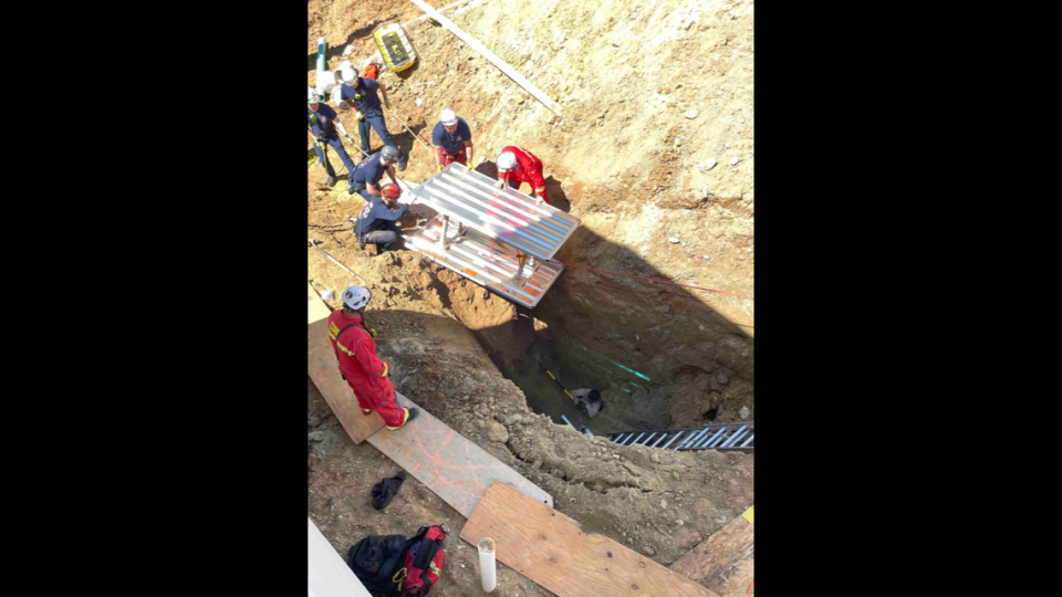 A trench collapsed at a construction site in Georgia, nearly burying a construction worker alive, photos show.