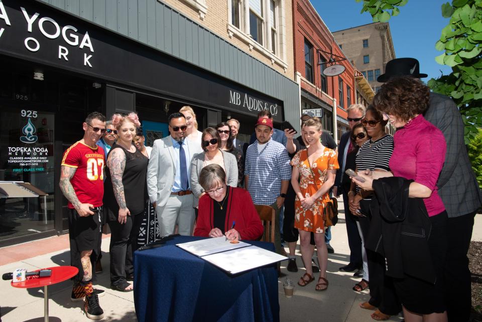 Gov. Laura Kelly signs a bill granting property tax relief to retail storefronts affected by government public health orders during the COVID-19 pandemic.