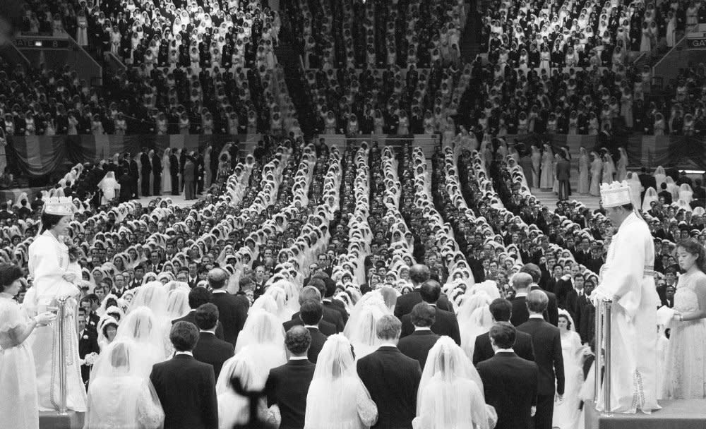 Unification Church leader Rev. Moon and his wife marry 2,075 pairs of his followers at Madison Square Garden on New Years Day, 1982.<span class="copyright">Bettmann Archive/Getty Images</span>