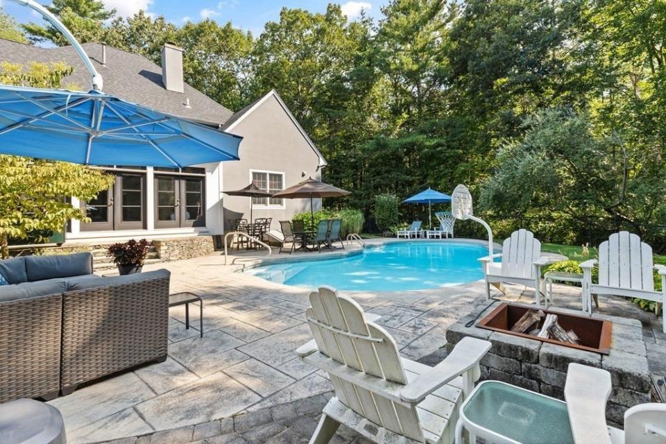 This house at 18 Julie Road in Easton sold for $1,410,000 on Dec. 14, 2023.The backyard is an oasis with a heated in-ground pool and fire pit, according to the real estate listing by by Jennifer Weinstein Kligman, Weinstein Keach/Coldwell Banker Easton.