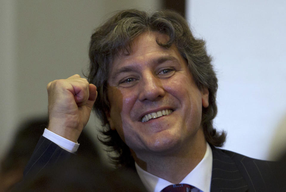 Argentina's Vice President Amado Boudou gestures as he arrives to a ceremony at which Argentina's President Cristina Fernandez signed into law the takeover of the YPF oil company in Buenos Aires, Argentina, Friday, May 4, 2012. Fernandez signed into law her expropriation of Spanish-owned Repsol's controlling stake in her country's privatized state energy company. (AP Photo/Natacha Pisarenko)