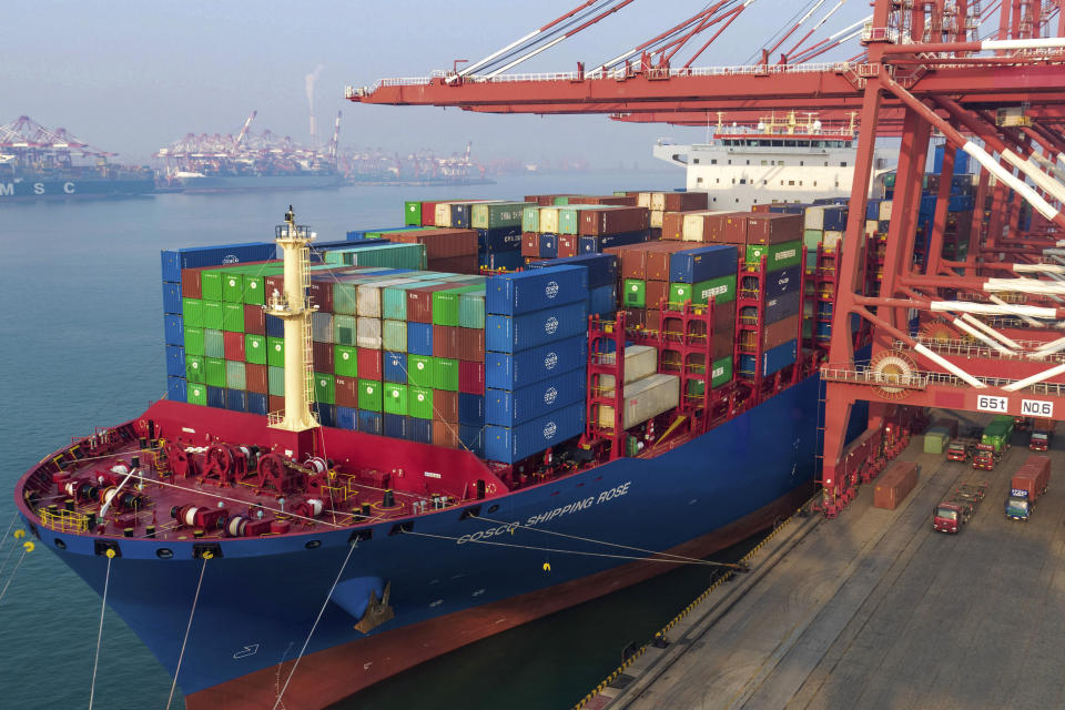 In this Friday, Jan. 11, 2019, photo, containers are loaded onto a cargo ship at a port in Qingdao in east China's Shandong province. China's trade growth slowed in 2018 as a tariff battle with Washington heated up and global consumer demand weakened. Exports rose 7.1 percent, customs data showed Monday, Jan. 14, 2019, down from the 7.9 percent reported earlier for 2017. Import growth declined to 12.9 percent from the previous year's 15.9 percent. (Chinatopix via AP)