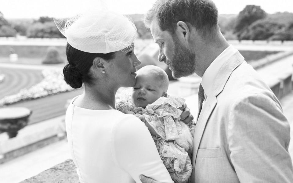 The family of three on the day of Archie's christening.