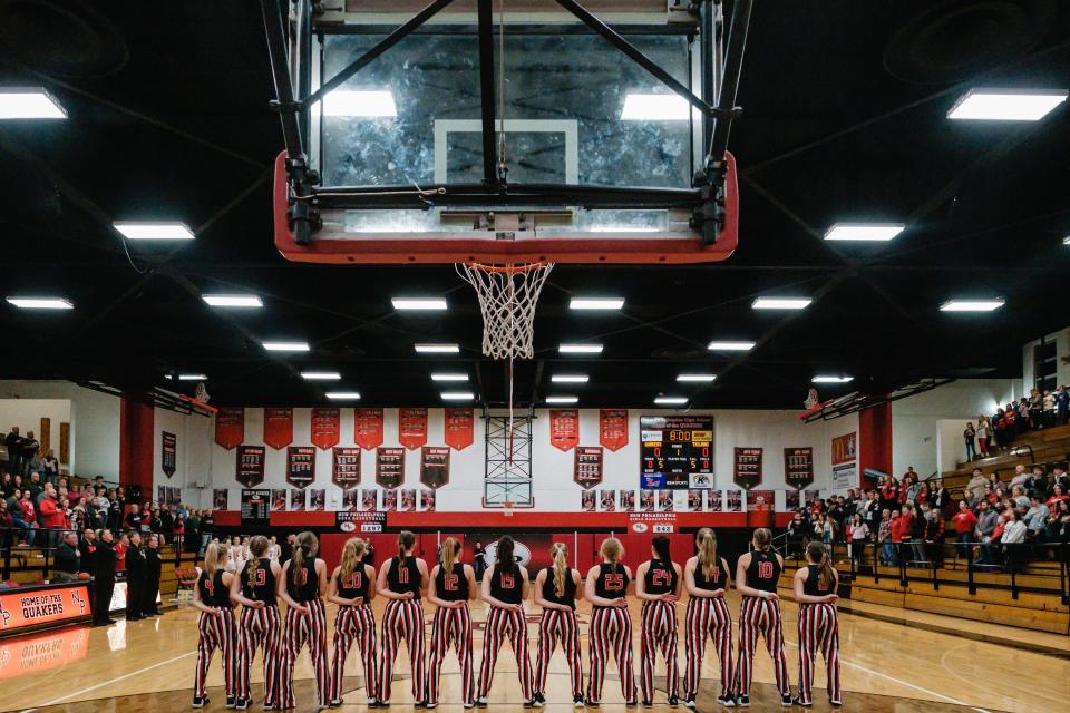 The Tusky Valley girls basketball team takes in the playing of the National Anthem during the last home game at New Philadelphia, Wednesday, Feb. 8.