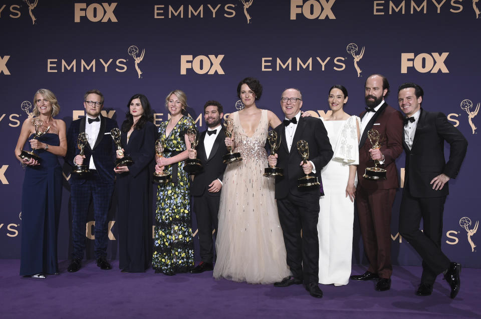 Harry Bradbeer, fourth from right, winner of the award for outstanding directing for a comedy series, and the cast and crew of "Fleabag," winners of the award for outstanding comedy series, pose in the press room at the 71st Primetime Emmy Awards on Sunday, Sept. 22, 2019, at the Microsoft Theater in Los Angeles. (Photo by Jordan Strauss/Invision/AP)