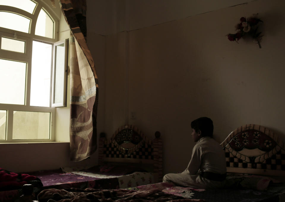 A boy sits on his bed in a rehabilitation center for former child soldiers in Marib, Yemen, in this July 28, 2018 photo. Children forced to fight in Yemen’s civil war are often left traumatized, acting out aggressively and having panic attacks, some still bearing the mental scars from indoctrination by Houthi rebels who taught them to kill and die in a “holy war.” (AP Photo/Nariman El-Mofty)