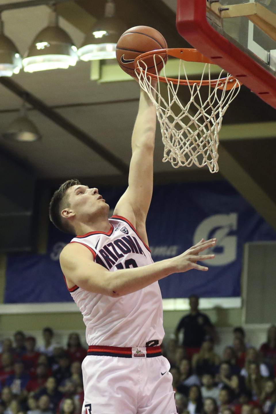 Arizona forward Azuolas Tubelis (10) makes a basket against Cincinnati during the second half of an NCAA college basketball game, Monday, Nov. 21, 2022, in Lahaina, Hawaii. (AP Photo/Marco Garcia)