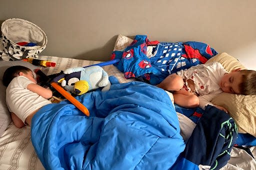 Bethaney Phillips' two kids sleeping in her oldest son's bed together.