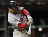 FILE - In this Thursday, Aug. 30, 2018, file photo, Boston Red Sox's Mookie Betts hits a two-run home run against the Chicago White Sox during the seventh inning of a baseball game in Chicago. Betts and the World Series champion Red Sox agreed to a $20 million, one-year contract on Friday, a $9.5 million raise for an arbitration-eligible player that topped pitcher Max Scherzer’s $8.8 million raise from Detroit in 2014. (AP Photo/Jim Young, File)