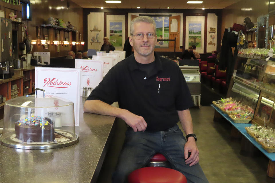 Ron Stark, co-owner of Holsten's, the Bloomfield N.J. ice cream parlor and restaurant where the final scene of "The Sopranos" TV series was filmed, sits at a counter on March 5, 2024, a day after the booth where Tony Soprano may or not have met his end at the series conclusion was sold in an online auction for $82,600 to a buyer that wishes to remain anonymous. (AP Photo/Wayne Parry)