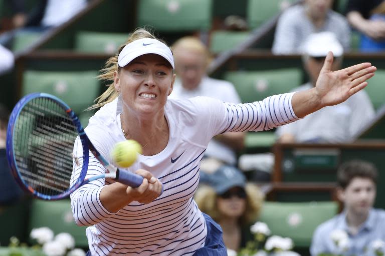 Maria Sharapova returns the ball to Vitalia Diatchenko during the women's second round at the French Open in Paris on May 27, 2015