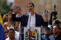 Juan Guaido, head of Venezuela's opposition-run congress, declares himself interim president of Venezuela, during a rally demanding President Nicolas Maduro's resignation in Caracas, Venezuela, Wednesday, Jan. 23, 2019. (AP Photo/Fernando Llano)