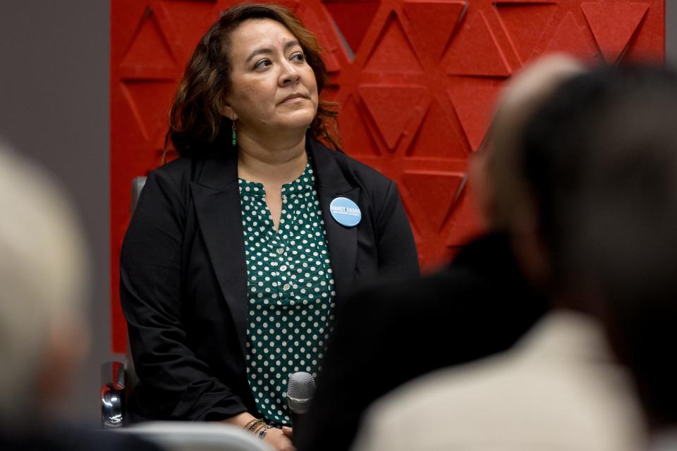 Former assistant district attorney Nancy Casas listens as El Paso attorney James Montoya introduces himself at the El Paso Chamber’s forum on Jan. 18, 2024, for candidates seeking the district attorney seat in the upcoming election.