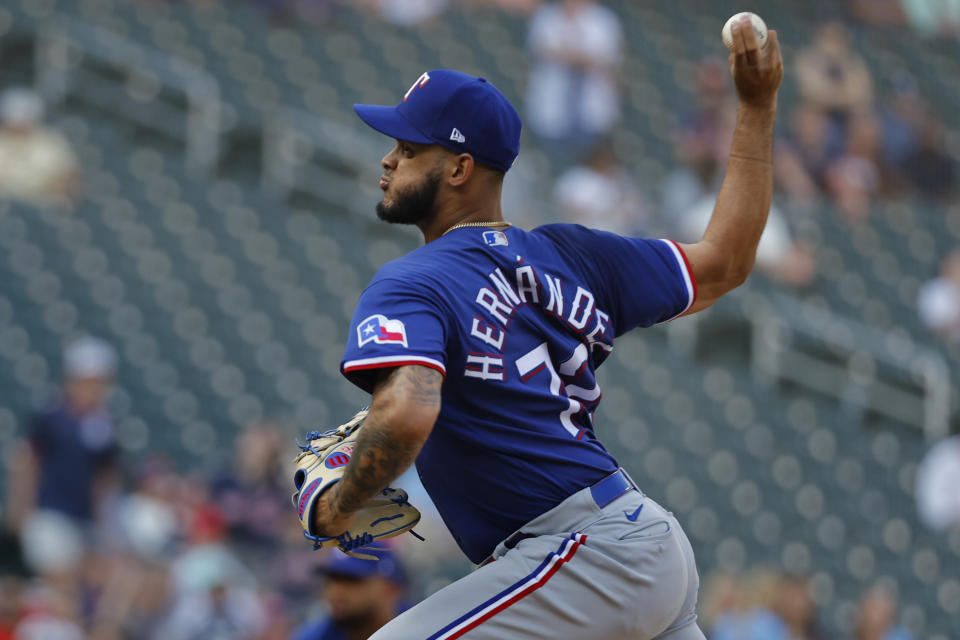 Texas Rangers relief pitcher Jonathan Hernandez throws to the Minnesota Twins in the 13th inning of a baseball game Sunday, Aug. 27, 2023, in Minneapolis. The Twins won 7-6 in 13 innings. (AP Photo/Bruce Kluckhohn)