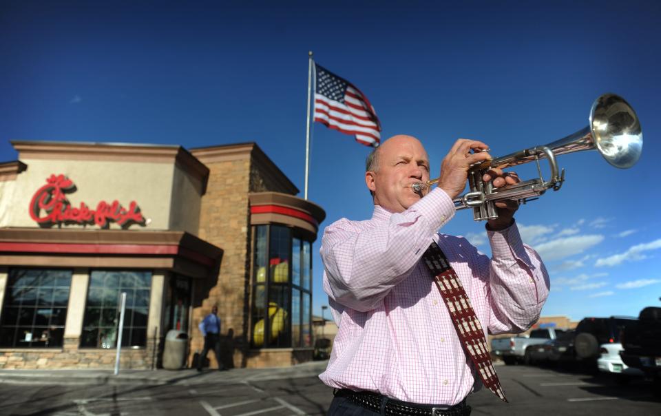Chick-fil-A Inc. president and COO Dan Cathy, son of the chain's founder Truett Cathy, sounds the trumpet while visiting one of his franchises.
