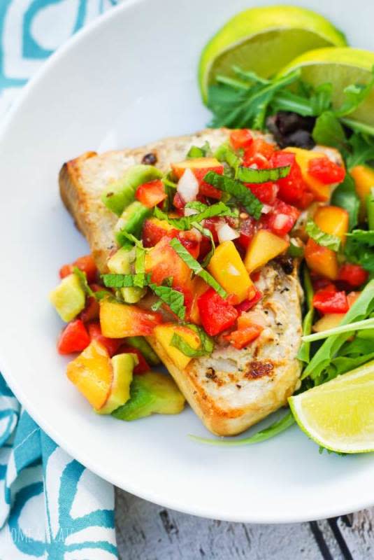 <p>Home and Plate</p><p>Peaches, tomatoes and avocados make the best fruit salsa for fish. This recipe uses grilled swordfish and can be ready and on the table in under 30 minutes.</p><p><strong>Get the recipe: <a href="https://www.homeandplate.com/blog/grilled-swordfish-with-a-fruit-salsa/" rel="nofollow noopener" target="_blank" data-ylk="slk:Grilled Swordfish with Fruit Salsa;elm:context_link;itc:0;sec:content-canvas" class="link rapid-noclick-resp">Grilled Swordfish with Fruit Salsa</a></strong></p>