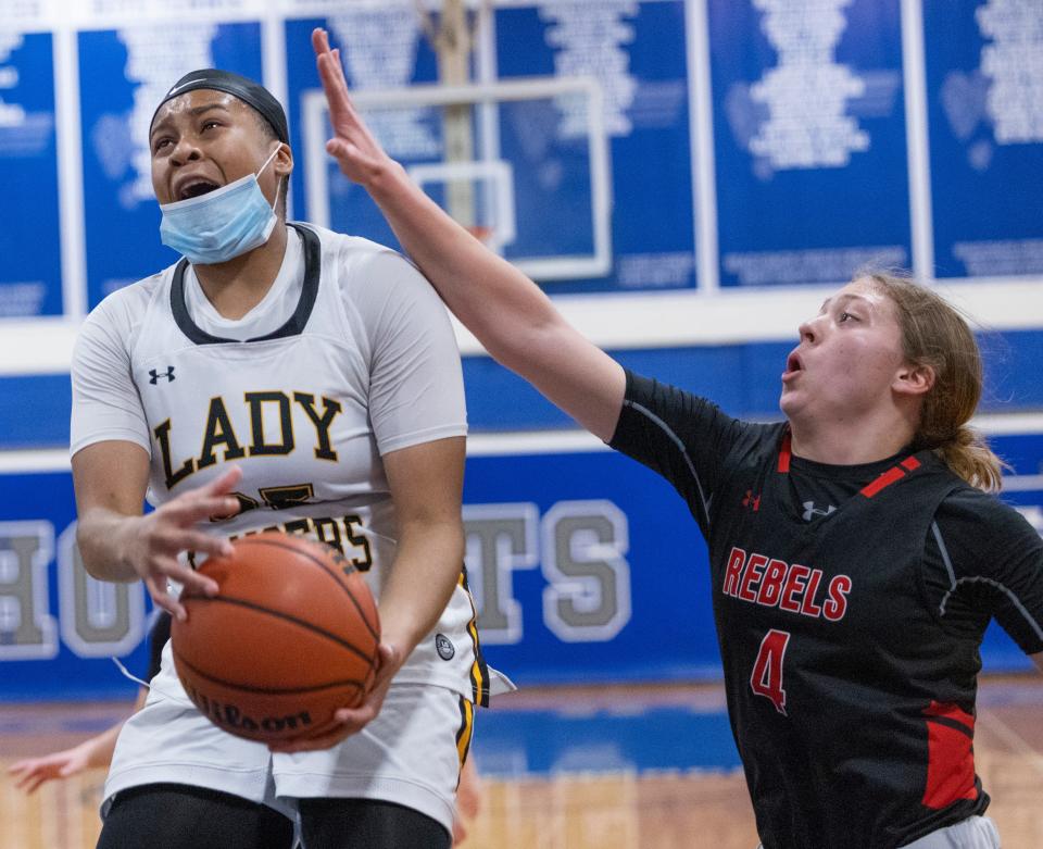 SJV Zoe Brooks goes up with a shot as Saddle River Julianna Almeida tries to block her. St. John Vianney Girls Basketball vs Saddle River Day in Coaches Choice Basketball Tournament at Holmdel on February 6, 2022. 