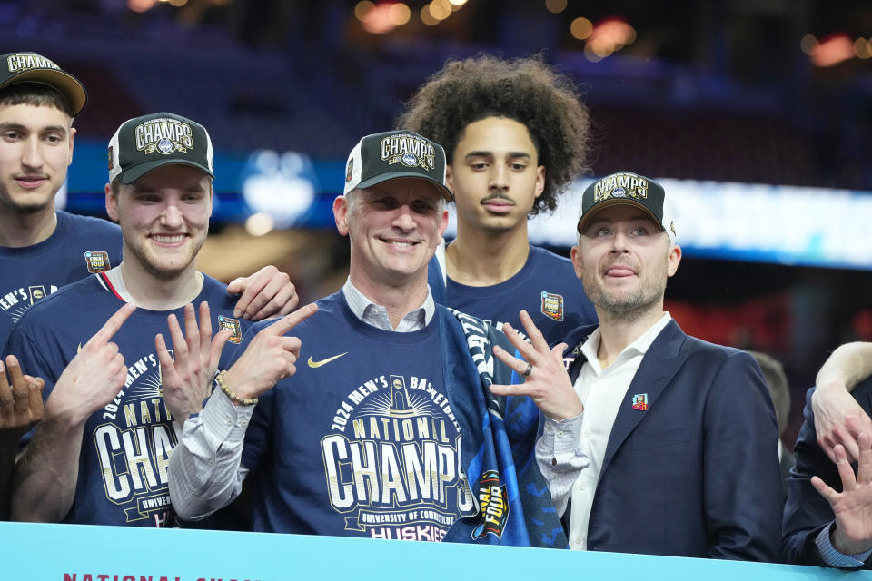 GLENDALE, ARIZONA - APRIL 08:  Head coach Dan Hurley and the Connecticut Huskies celebrates after the National College Basketball Championship game against the Purdue Boilermakers at State Farm Stadium on April 08, 2024 in Glendale, Arizona.  (Photo by Mitchell Layton/Getty Images)