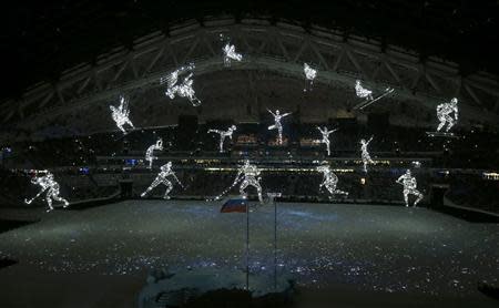 Suspended figures representing different sports are lit during the opening ceremony of the 2014 Sochi Winter Olympics, February 7, 2014. REUTERS/Issei Kato