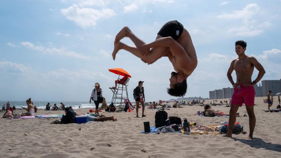 PHOTO: People spend the day at Rockaway Beach as high temperatures return in New York City, June 26, 2024. (Spencer Platt/Getty Images)