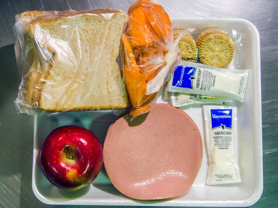 ORANGE, CA - MARCH 14: An example of a lunch that include bologna, two pieces of bread, mayonnaise, an apple, carrots and crackers at the Theo Lacy Facility in Orange, California, on Tuesday, March 14, 2017. Detainees in Module I at the Theo Lacy Facility. The Orange County sheriff conducted a media tour of the jail that included the intake area, the kitchen, an isolation unit and a modular holding area. (Photo by Jeff Gritchen/Digital First Media/Orange County Register via Getty Images)