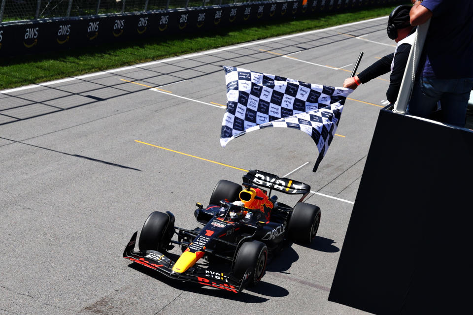 MONTREAL, QUEBEC - JUNE 19: Race winner Max Verstappen of the Netherlands driving the (1) Oracle Red Bull Racing RB18 takes the chequered flag during the Formula 1 Grand Prix of Canada at Circuit Gilles Villeneuve on June 19, 2022 in Montreal, Quebec. (Photo by Clive Rose/Getty Images)