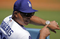 Los Angeles Dodgers manager Dave Roberts gestures in the dugout during the first inning of a baseball game against the Colorado Rockies, Sunday, Oct. 2, 2022, in Los Angeles. (AP Photo/Marcio Jose Sanchez)