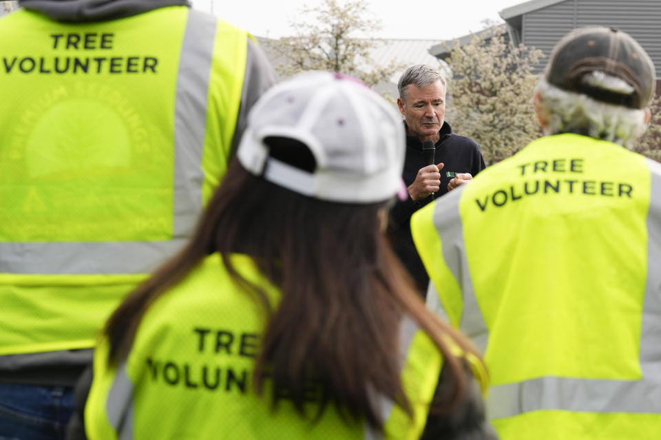 American Forests President and CEO Jad Daley speaks during a tree planting event with the Tacoma Tree Foundation and Weyerhaeuser at Mount Tahoma High School, an area with only 11% tree cover, Friday, April 14, 2023, in Tacoma, Wash. The planting event followed the Thursday launch of the Washington Tree Equity Collaborative, a statewide partnership between American Forests and the Washington State Department of Natural Resources. (AP Photo/Lindsey Wasson)