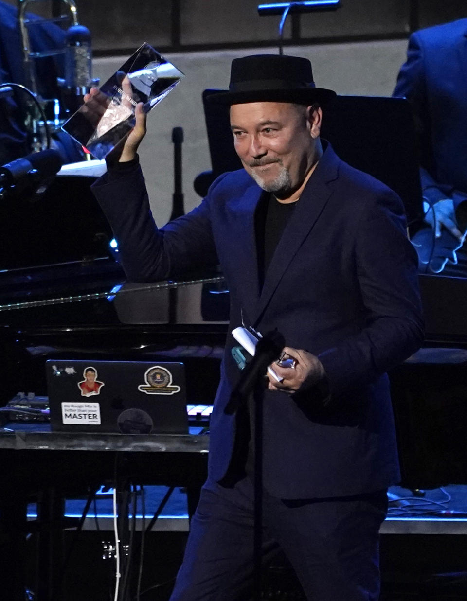 Ruben Blades accepts the person of the year award at the Latin Recording Academy Person of the Year gala in his honor at the Mandalay Bay on Wednesday, Nov. 17, 2021, in Las Vegas. (AP Photo/Chris Pizzello)