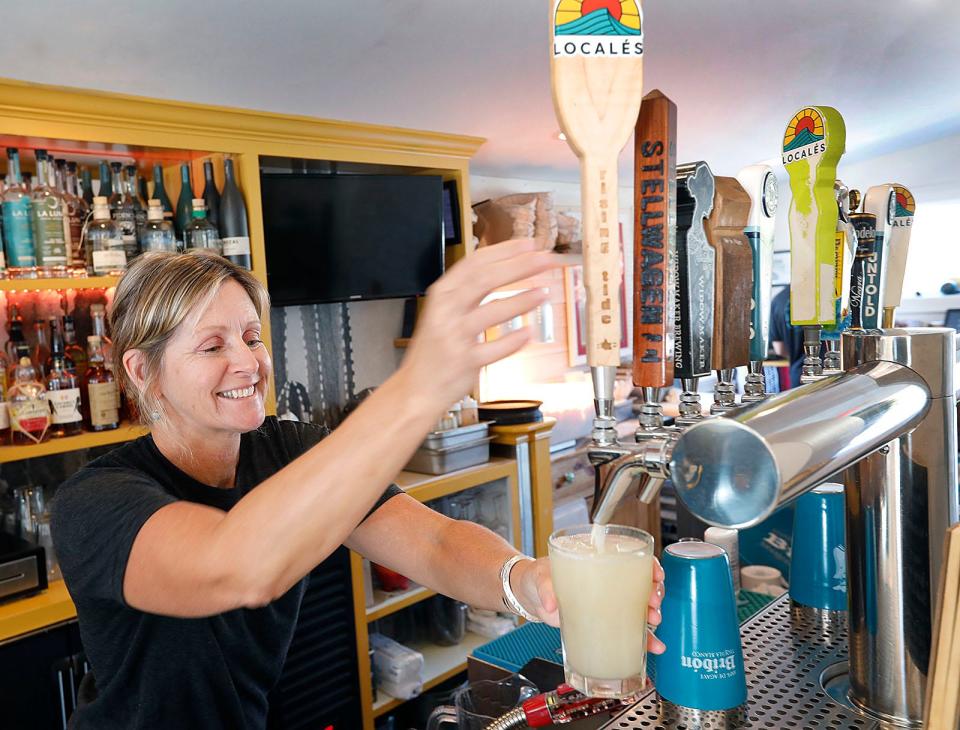 Bartender Ginny Wilson Canney draws a margarita from the tap at Locales Tacos y Tequila at Crow Point in Hingham on Thursday, Sept. 29, 2022.